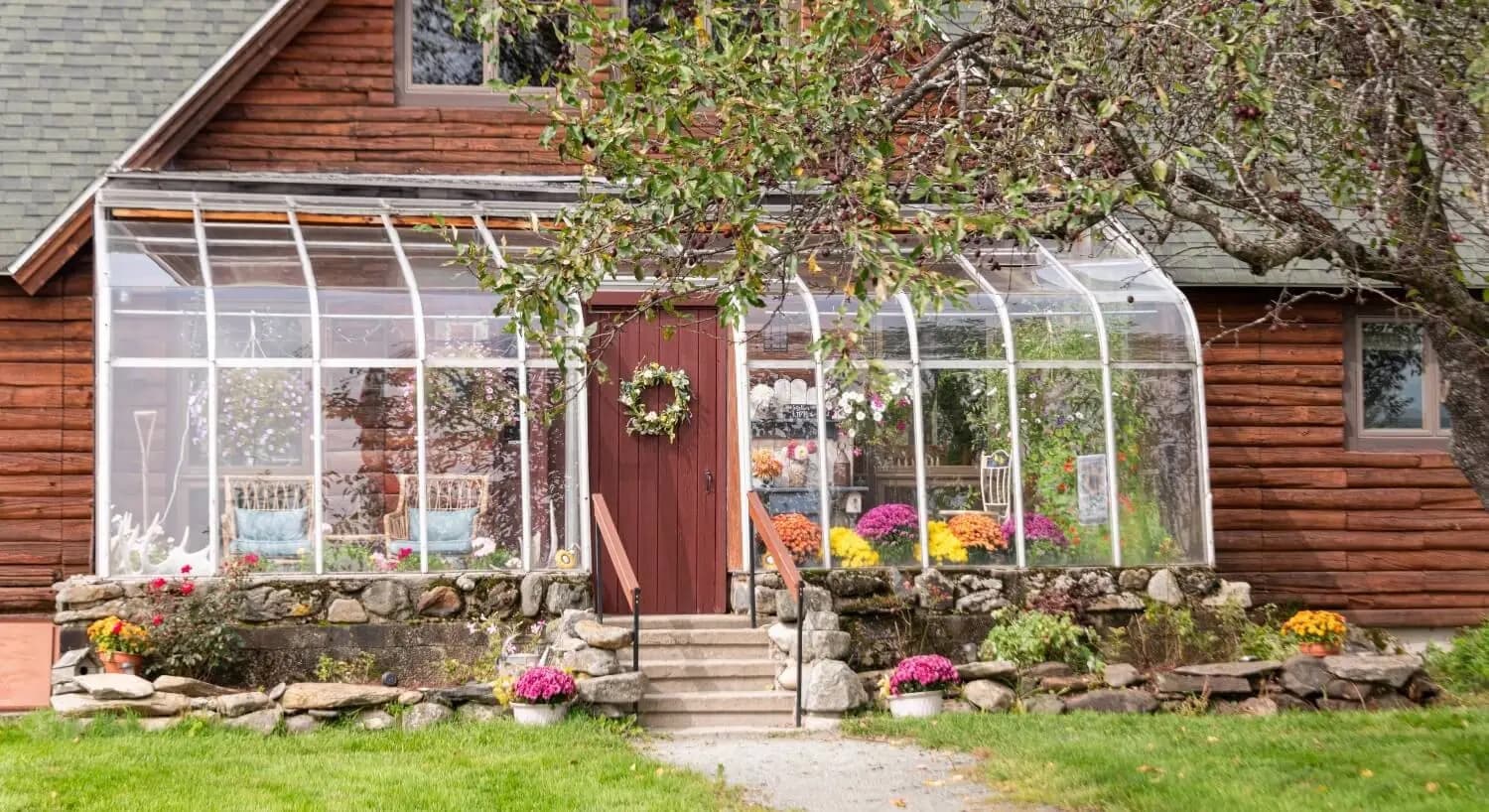 Glass sunroom on the front of the log home inn